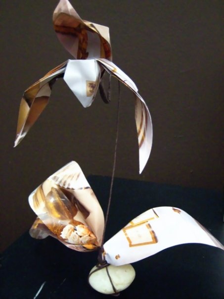 An original origmai model I developed and folded from magazine paper, meant to look like a paphiopedalum orchid